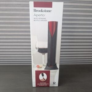 Brookstone Aperto Auto-Sensing Opener in Black and Red
